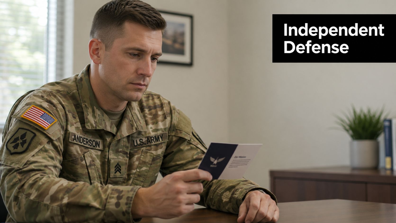 Fort Knox Military Defense Lawyers: Your 2026 Legal Shield 3 A U.S. Army soldier in uniform reading a pamphlet while sitting at a desk in an office.